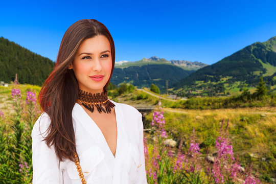 Beautiful young woman in the Swiss Alps