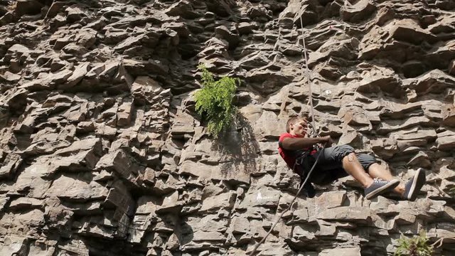 Young man on a rock climbing