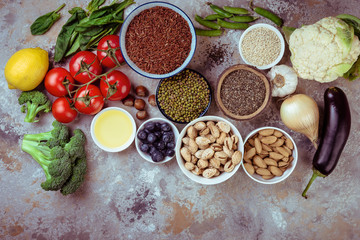 Selection of  food for health, cereals, nuts, fruits, vegetables and greens. Flat lay