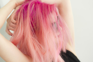 Pink hair girl with sunglasses in easygoing pose