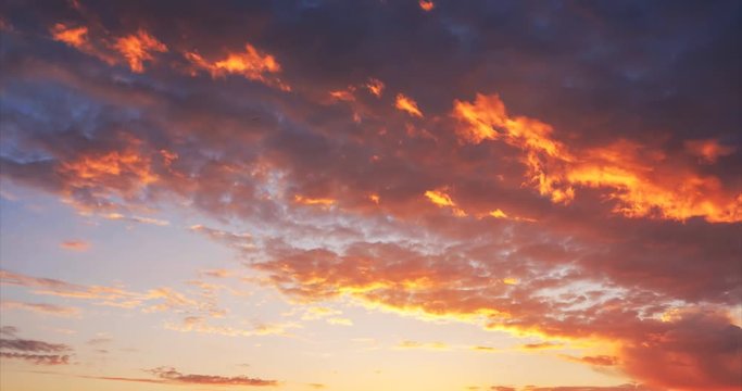 burning orange clouds at sunset