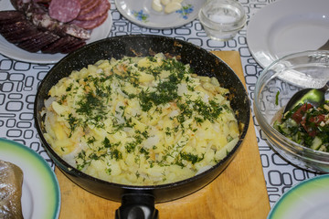Fried potatoes in an iron pan
