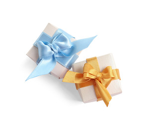 Beautifully wrapped gift boxes on white background, top view