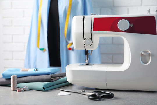 Sewing machine, fabrics and accessories for tailoring on table