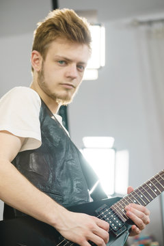Man playing on electric guitar
