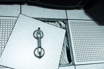 Lifted raised floor and suction tools in datacenter