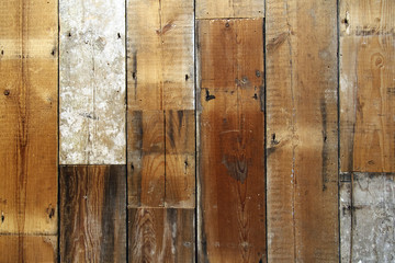 Rich colours in a wood grain background of timber planks of wood for panelling or floor covering.