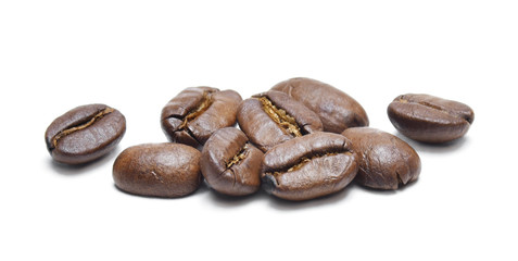 Roasted coffee beans, isolated on white background. Close-up shot of delicious arabica beans, pile or group of objects, cut out.