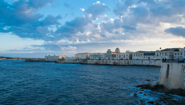 beautiful sunset over the harbor, Syracuse, italy, sicily.