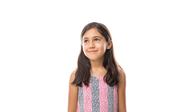 Girl looking away smiling on a light background portrait