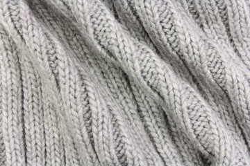 gray fabric texture of rough knitting with folds