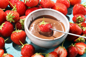 Fondue with Melting chocolate or melted chocolate and strawberry.