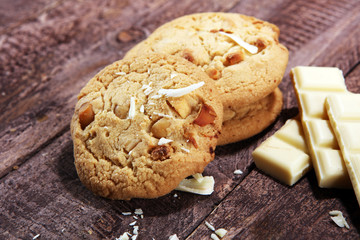 stack of macadamia nut and white chocolate cookies on table with chocolate chip
