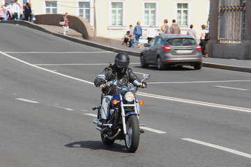 biker riding a motorbike on the road