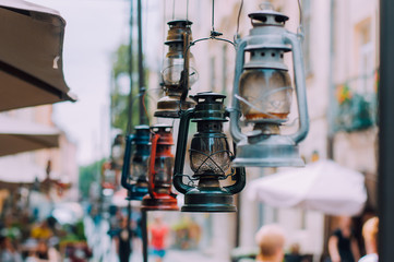 Vintage gas lamps weigh in the old European city. The concept of decor in the restaurant. Intagram filter.