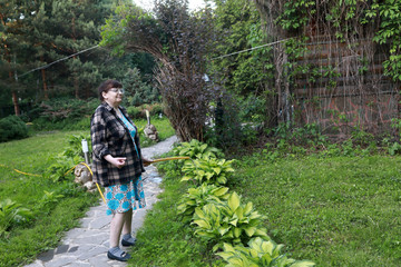 Woman watering garden