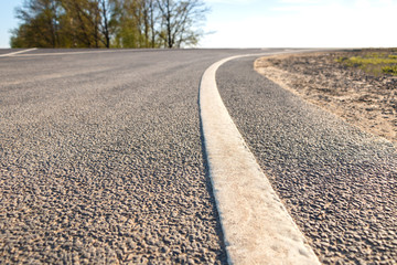 Road marking line on asphalt close-up