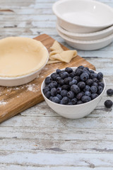 Homemade small individual blueberry pies with fresh summer blueberries