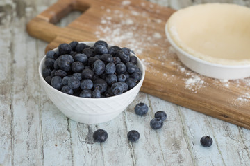 Homemade small individual blueberry pies with fresh summer blueberries