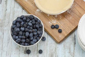 Homemade small individual blueberry pies with fresh summer blueberries