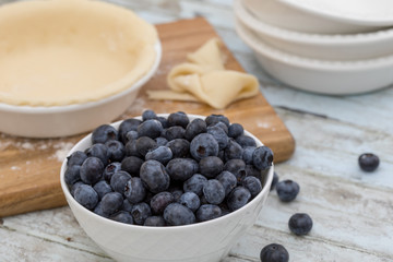 Homemade small individual blueberry pies with fresh summer blueberries