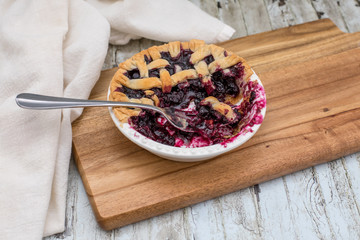 Homemade small individual blueberry pies with fresh summer blueberries
