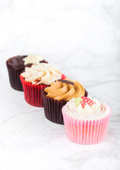Fresh cupcake muffins various taste on marble