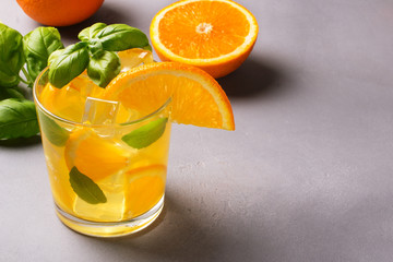 Glass of fresh orange juice with fresh fruits