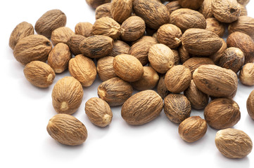 Dried of fragrant nutmeg isolated on white background.