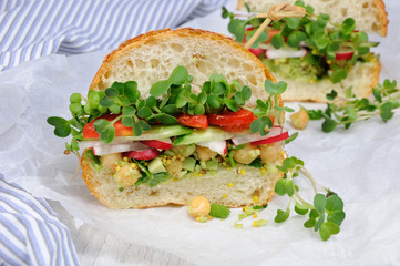 Sandwich with radish sprouts and vegetables