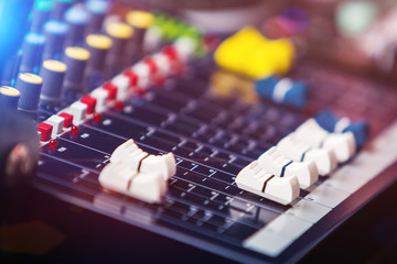 Audio Control Panel with adjusted slide bar in night club. DJ professional sound technology....