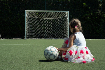 The football is a sport that the Italian peolple prefer in absolute. In the 2018 year Italy has not involved by World soccer championships. A young girl is sit down in a little stadium.