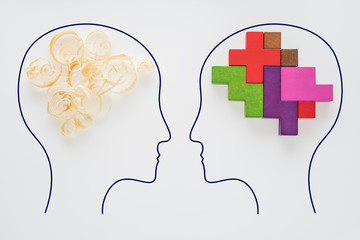 Heads of two people with sawdust brain shape and colorful geometric shape. Two people with...