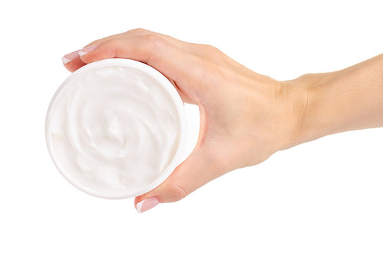 White Jar Of Cream For A Body In Hands On A White Background Isolation