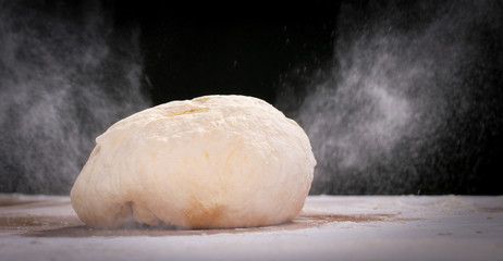 Making dough by female hands at home in kitchen