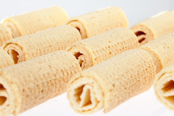 Wafer rolls. Gtoup of tasty crispy tube wafer on white background. Dessert