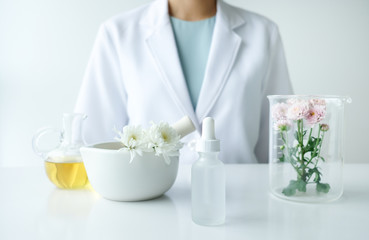the scientist,dermatologist testing the organic natural product in the laboratory.research and development beauty skincare concept.blank package,bottle,container .cream,serum.
