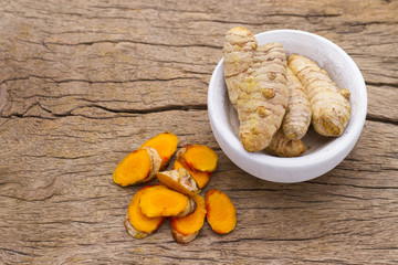 turmeric in bowl on table, top view