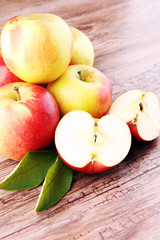 Ripe red apples on wooden background summer concept