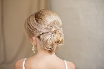Foto op Plexiglas Rear view of female hairstyle middle bun with blond hair. © Viktoria