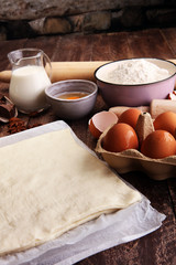 Bakery ingredients - flour, eggs, butter, sugar, yolk, almond nu