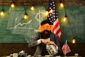 Economy and finance. Patriotism and freedom. Independence day of usa. Income planning of budget increase policy. Travel vacation concept. school in july 4. Bearded man with dollar money for bribe