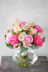 beautiful summer bouquet. flower arrangement with peonies. Color light pink. The concept of a flower shop.