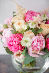 beautiful summer bouquet. flower arrangement with peonies. Color light pink. The concept of a flower shop.