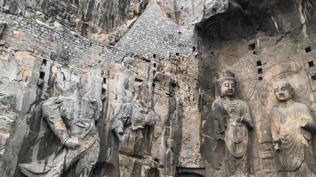 Panning view of the main Buddha statues in Longmen Grottoes,Luoyang, China