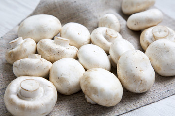 Fresh raw champignon mushrooms, side view. Closeup.