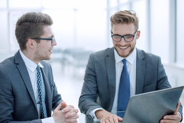 close up.colleagues working on a laptop in the office