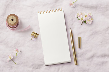 romantic feminine mockup with open / blank notebook, pink ribbon, writing supplies and cherry...