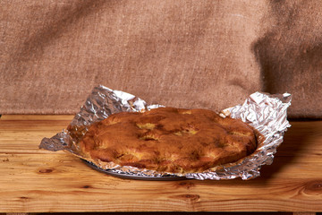 apricot pie baked in foil with ingredients cinnamon, abricot, eggs, flour, milk and sugar