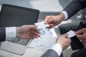 close up.business people exchanging business cards